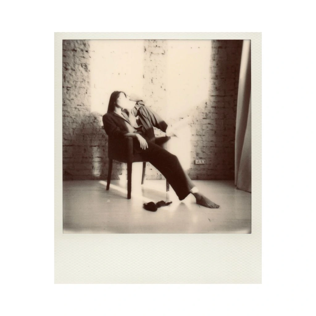 Portrait of co-founder Miriam Halberg at her library desk.